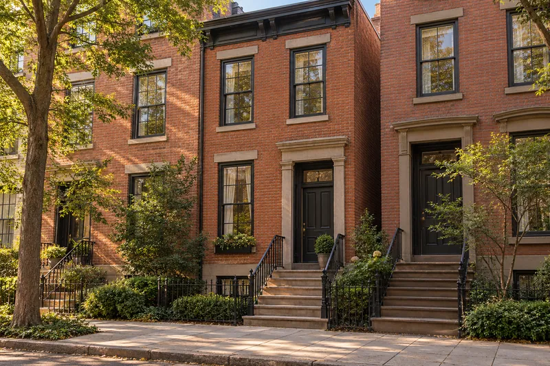 Illustration of attached brick row houses with stone steps, tall windows and decorative cornices